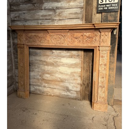 A Reclaimed Stripped Pine Neoclassical Carved Fire Surround