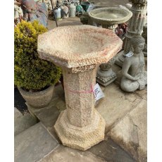 Carved natural stone birdbath