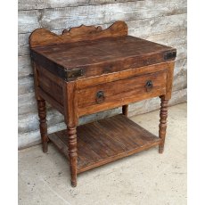 A Large Butchers Block On Stand
