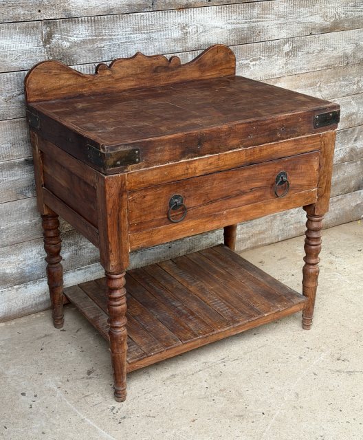 A Large Butchers Block On Stand