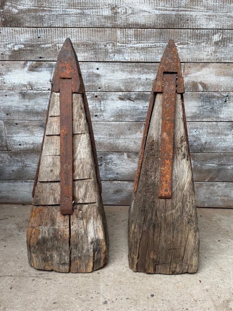 An Unusual Pair Of Iron Mounted Oak Pillar Caps