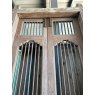 Pair of Tall Teak Metal Bar Doors