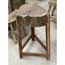 A Rustic Wooden Stump Butchers Block On Stand