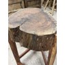 A Rustic Wooden Stump Butchers Block On Stand
