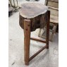 A Rustic Wooden Stump Butchers Block On Stand