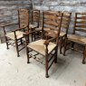 A Set Of 6 Rush Seated Ladder Back Oak Dining Chairs